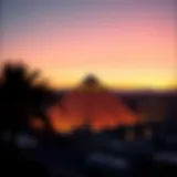 The iconic pyramid shape of the Pyramid Casino against the Las Vegas skyline at sunset.